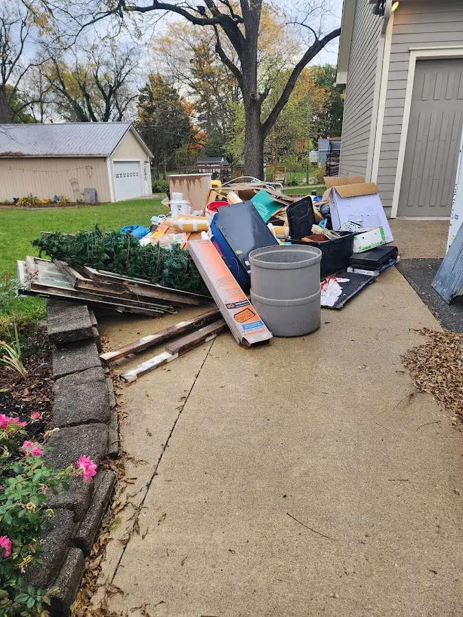 Dumpster being loaded with debris for Residential Dumpster Rental in Waverly